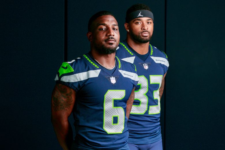 Quandre Diggs (6) and Jamal Adams (33) are photographed at Virginia Mason Athletic Center Monday, Aug. 29, 2022. (Erika Schultz / The Seattle Times)