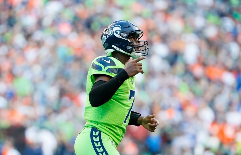 Seattle Seahawks quarterback Geno Smith celebrates a 25-yard touchdown during the second quarter Monday, Sept. 12, 2022, in Seattle. 221558