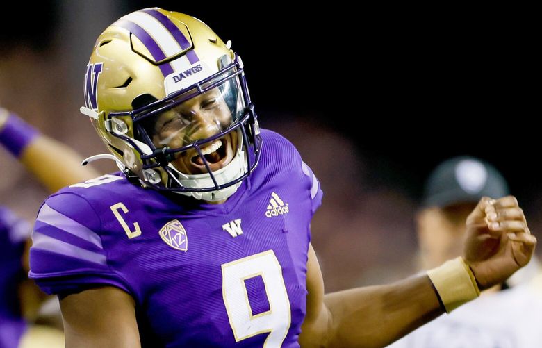 Washington Huskies quarterback Michael Penix Jr. celebrates his 30-yard touchdown pass during the third quarter, Saturday, Sept. 24, 2022, in Seattle. 221629