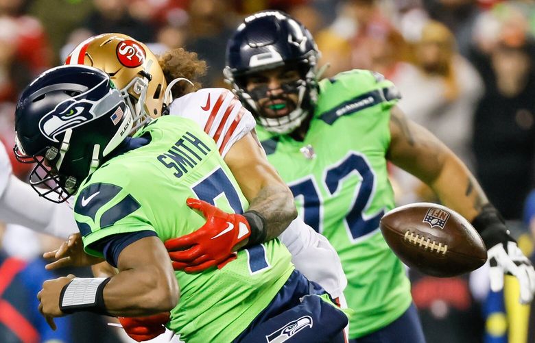 San Francisco 49ers safety Talanoa Hufanga hits Seattle Seahawks quarterback Geno Smith causing a fumble during the first quarter. The Seahawks would recover. 222453