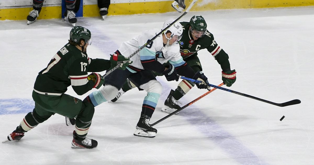 gameKraken and Wild Face Off in Hockey Game at Seattle Arena