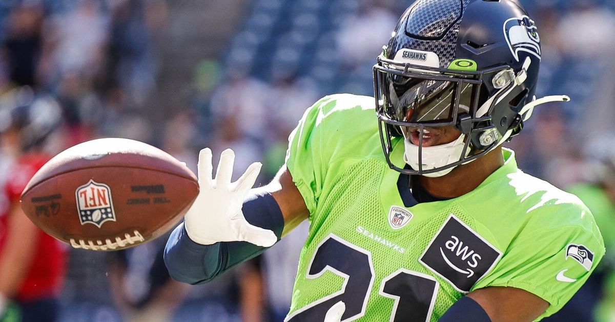 Devon Witherspoon, Seattle Seahawks' First-Round Draft Pick, Observes Practice from Sidelines