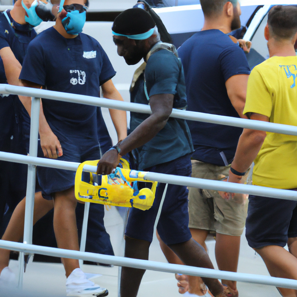 Akok Akok of West Virginia University Leaves Hospital After Suffering Collapse During Preseason Game