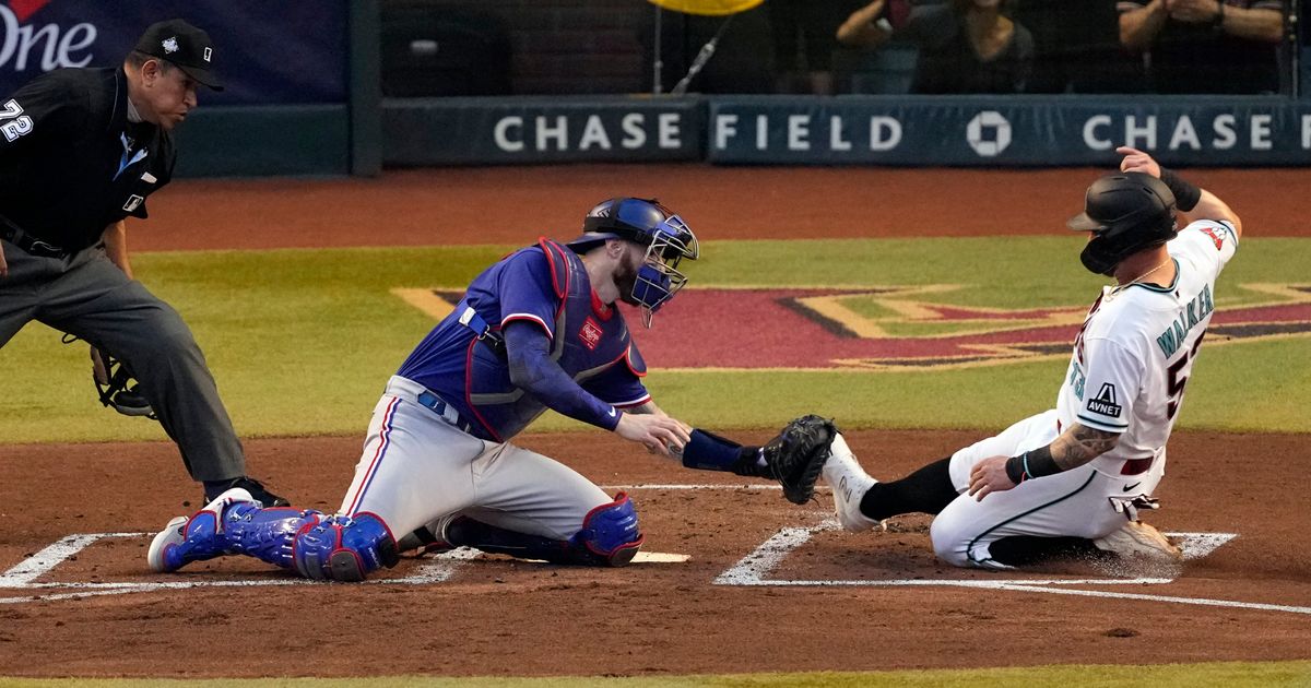 Christian Walker's Home Run Reaches Foul Territory, Thwarted by Adolis García in Game 3 of World Series