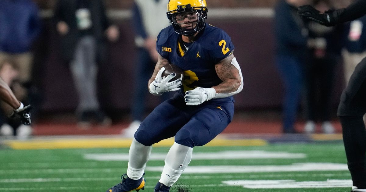 Michigan Star Corum Denies Involvement with Stalions, Unaware of Online Records in His Name