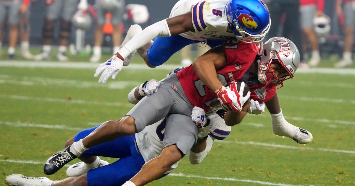 Kansas Overcomes Penalties to Defeat UNLV 49-36 in Guaranteed Rate Bowl Behind Six Touchdown Passes from Bean